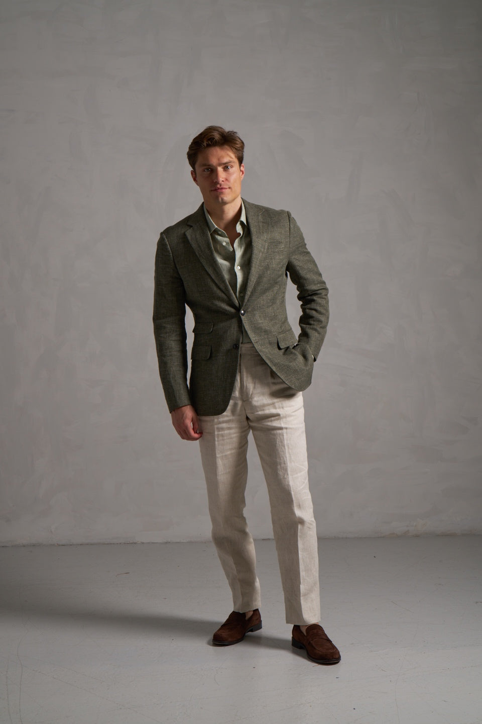 Green linen jacket with cream linen trousers