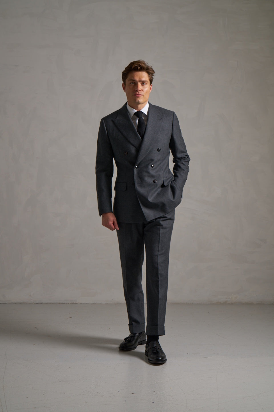 Charcoal double-breasted flannel suit, full length