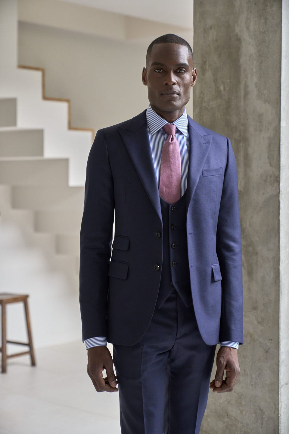 Grey double-breasted made-to-measure suit with a tie