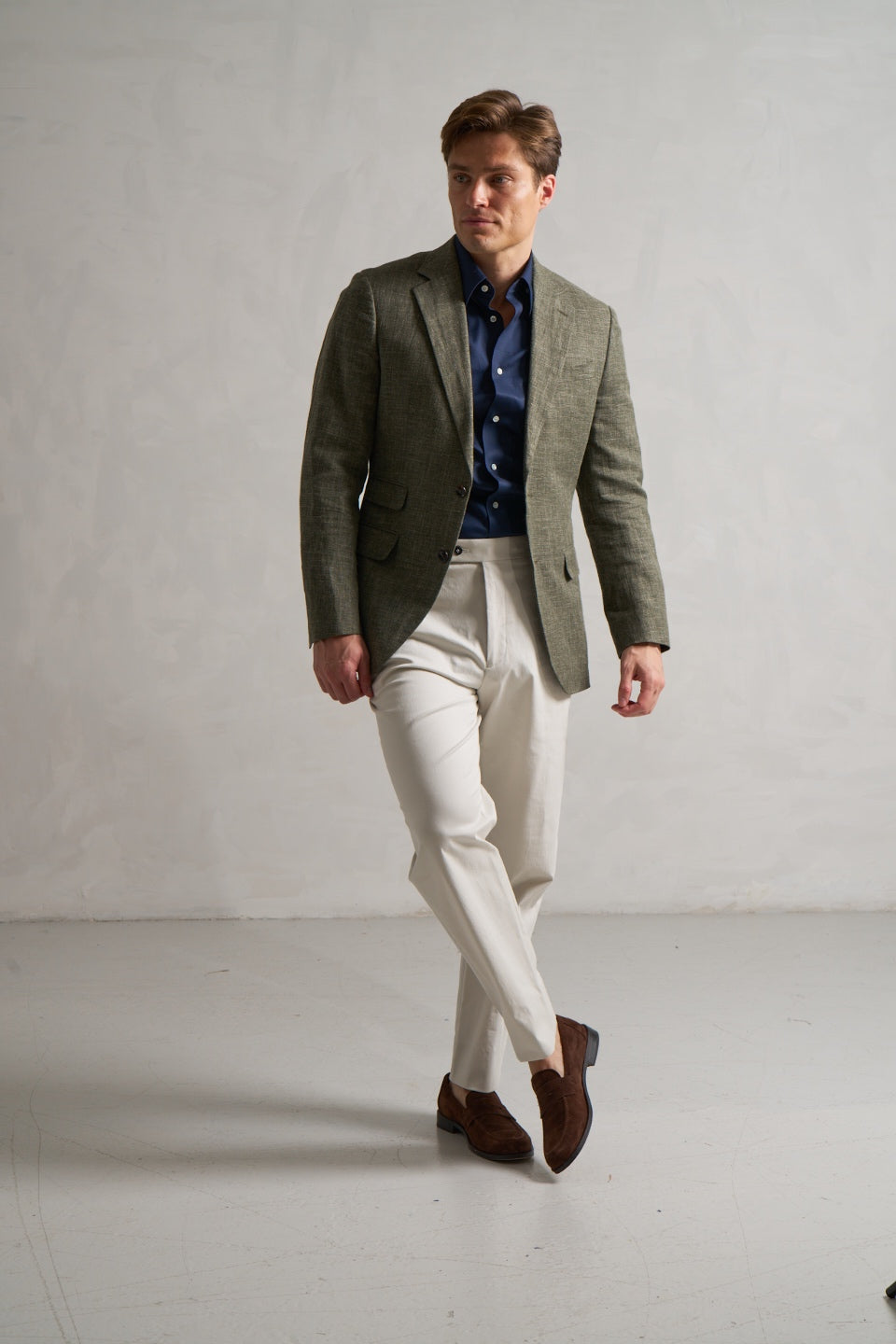 Green linen-blend made-to-measure jacket with cream trousers