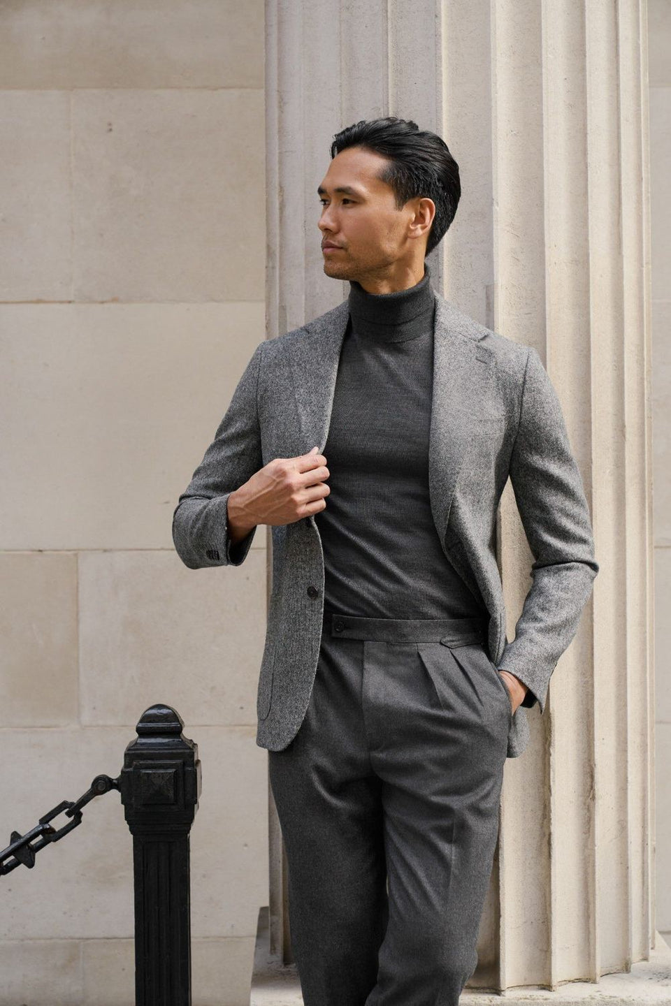Grey tweed made-to-measure jacket with charcoal roll-neck and trousers