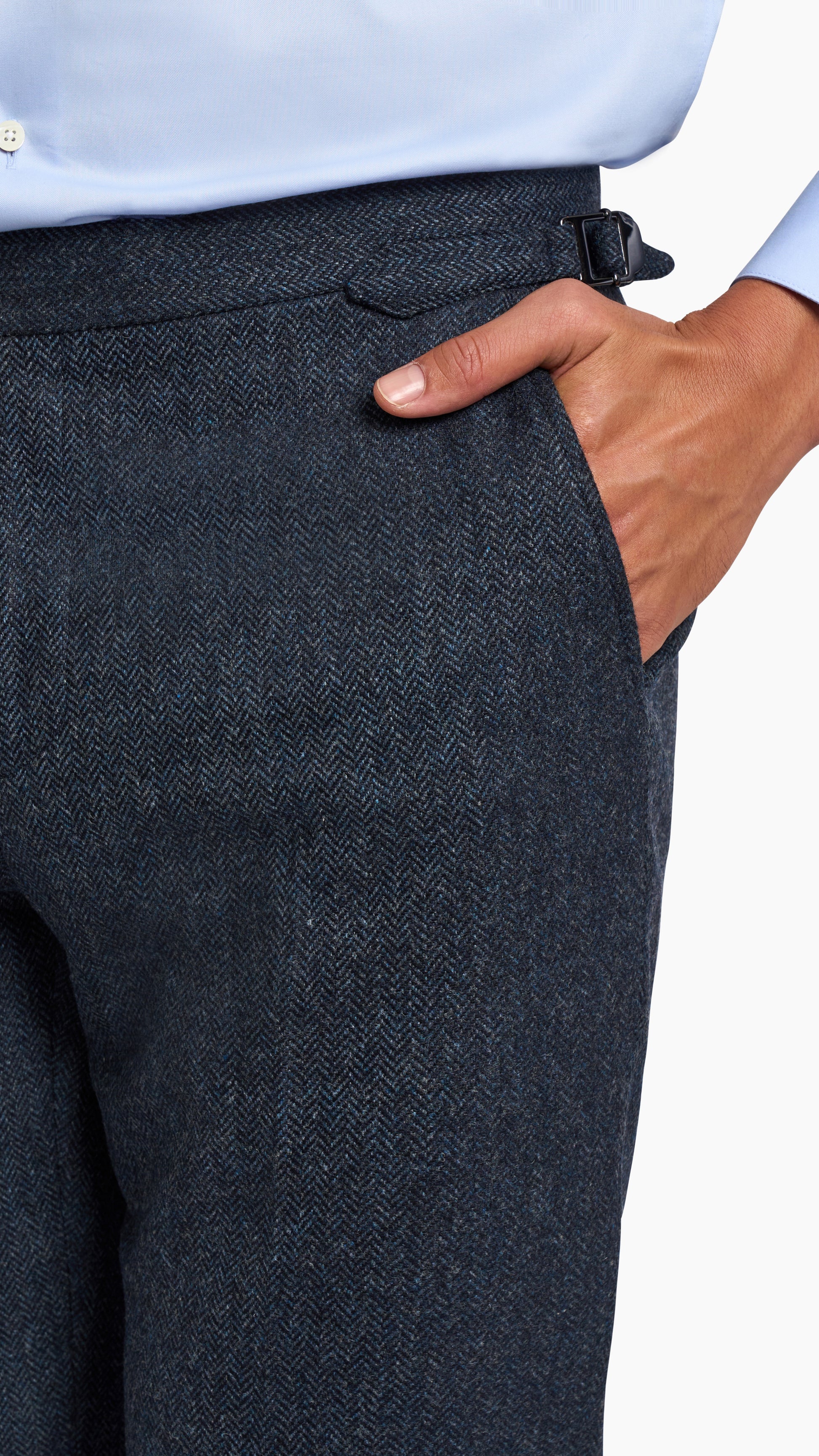Close-up of Abraham Moon Navy Tweed Suit trousers showing textured wool fabric and side adjuster detail.