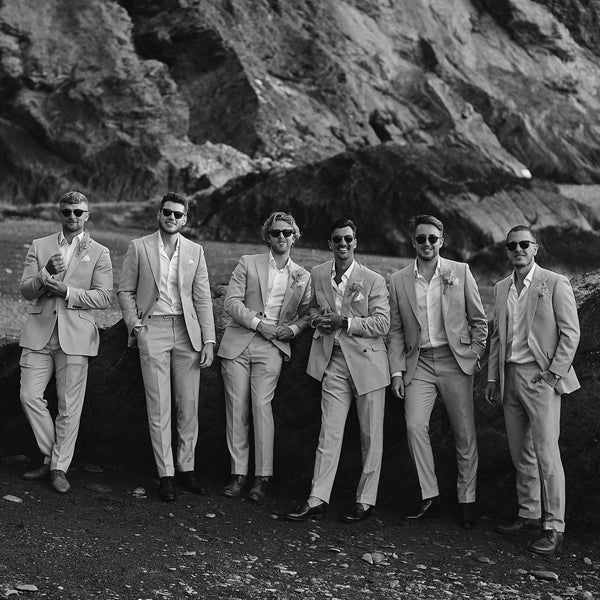 Groom weaing a tailored double breasted wedding suit