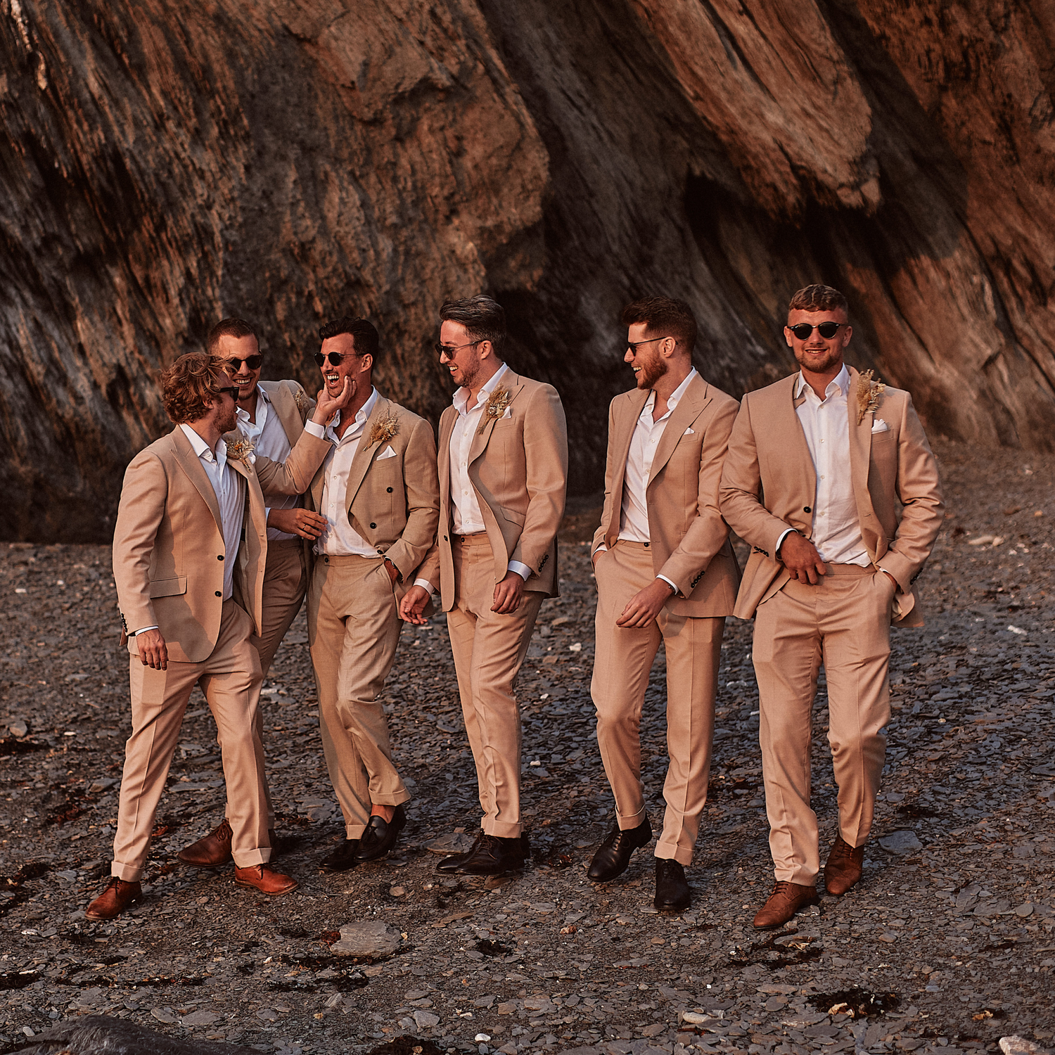 Groomsmen wearing a double breasted brown made to measure wedding suit