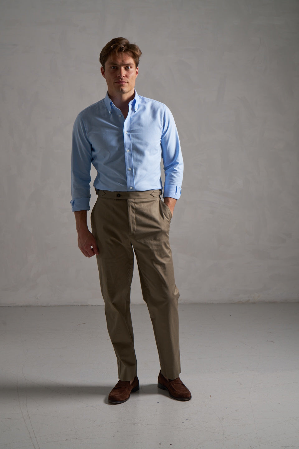 Light blue oxford shirt with khaki chinos, full length