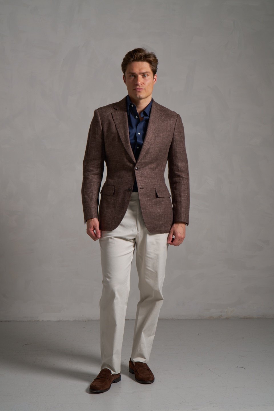 Cream made-to-measure trousers with a brown jacket
