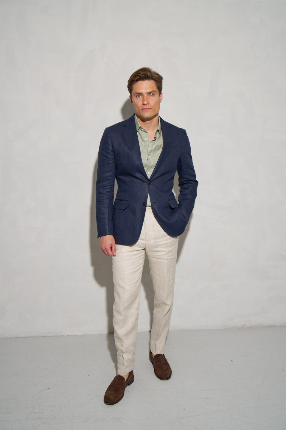 Navy linen blazer with light green shirt and linen trousers