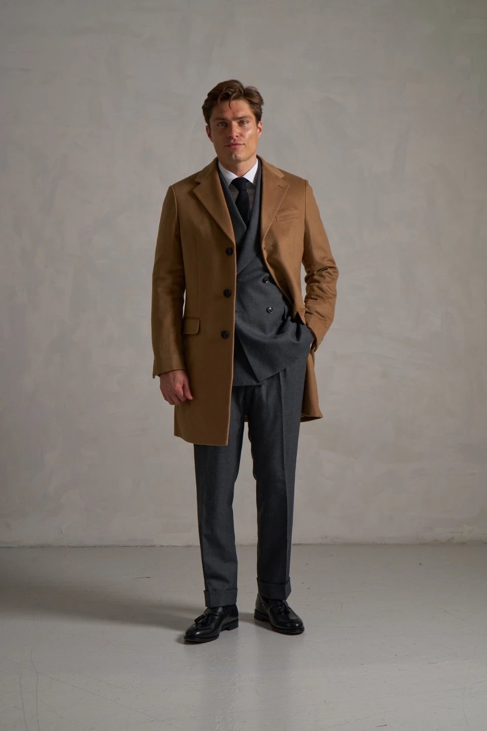 Camel made-to-measure overcoat over a grey double-breasted suit