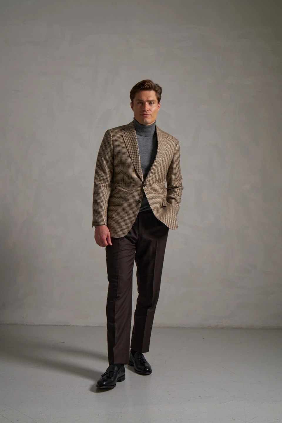 Houndstooth made-to-measure jacket with brown trousers
